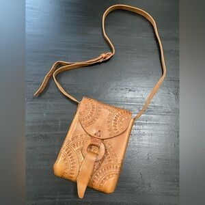 Embossed, crossbody purse with floral detailing